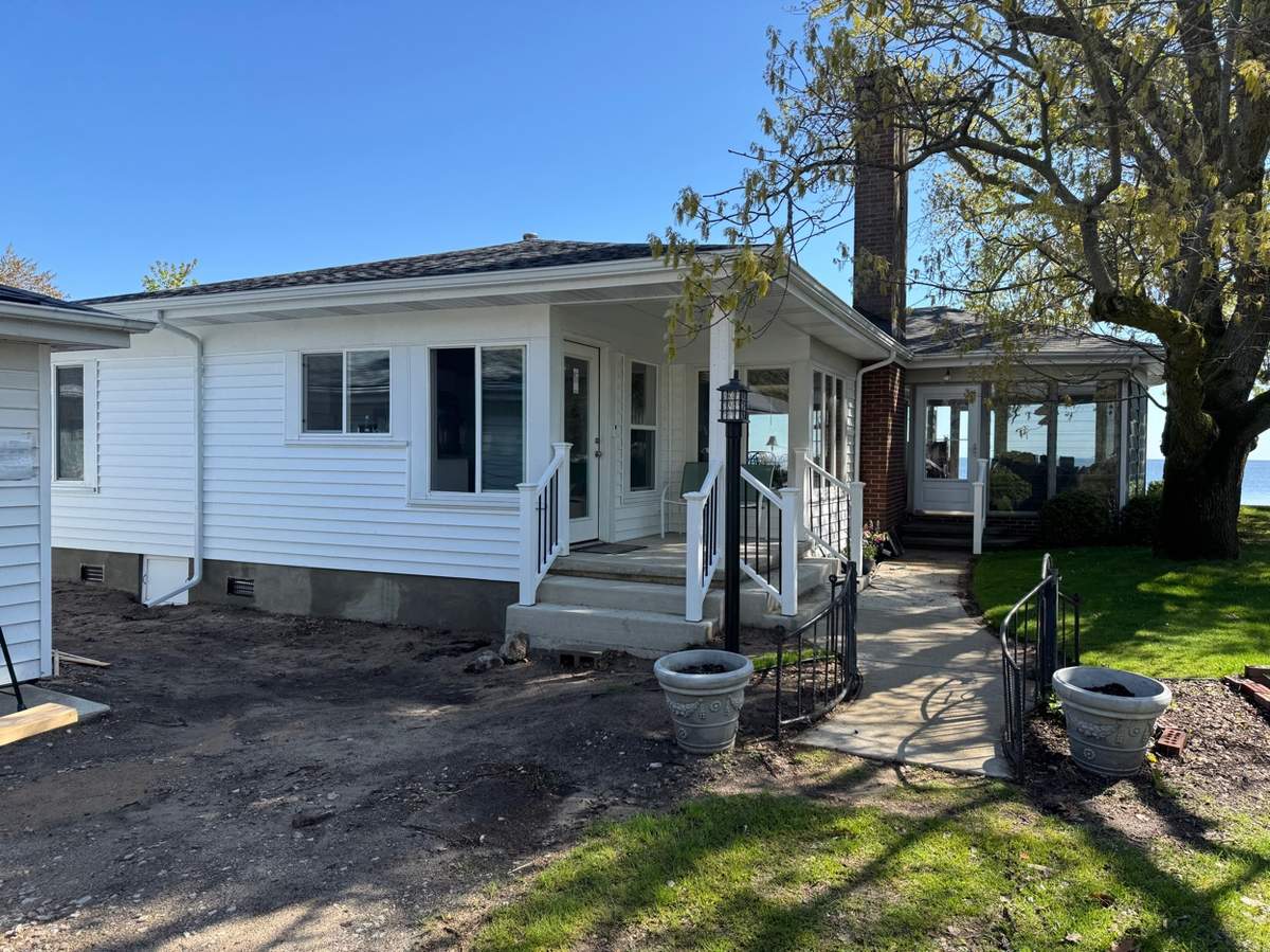 Worn porch before FastFix Remodeling renovation in Michigan
